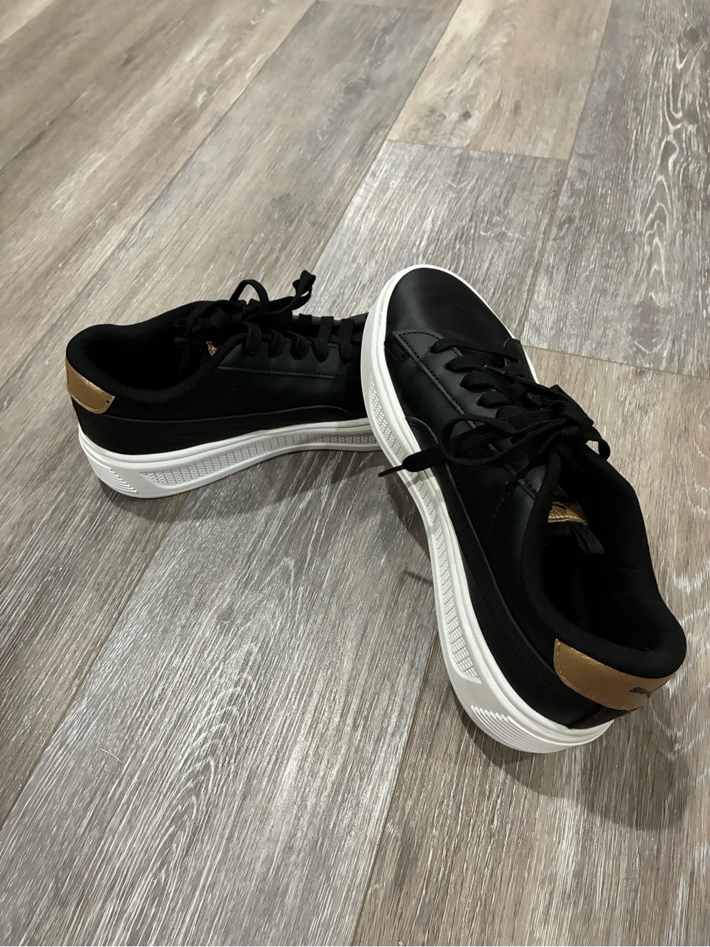 Puma Black Sneakers with Gold Accents and White Sole Women’s Size 9.5